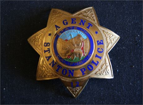 Obsolete. Stanton California Police badge, seven point star Defunct agency